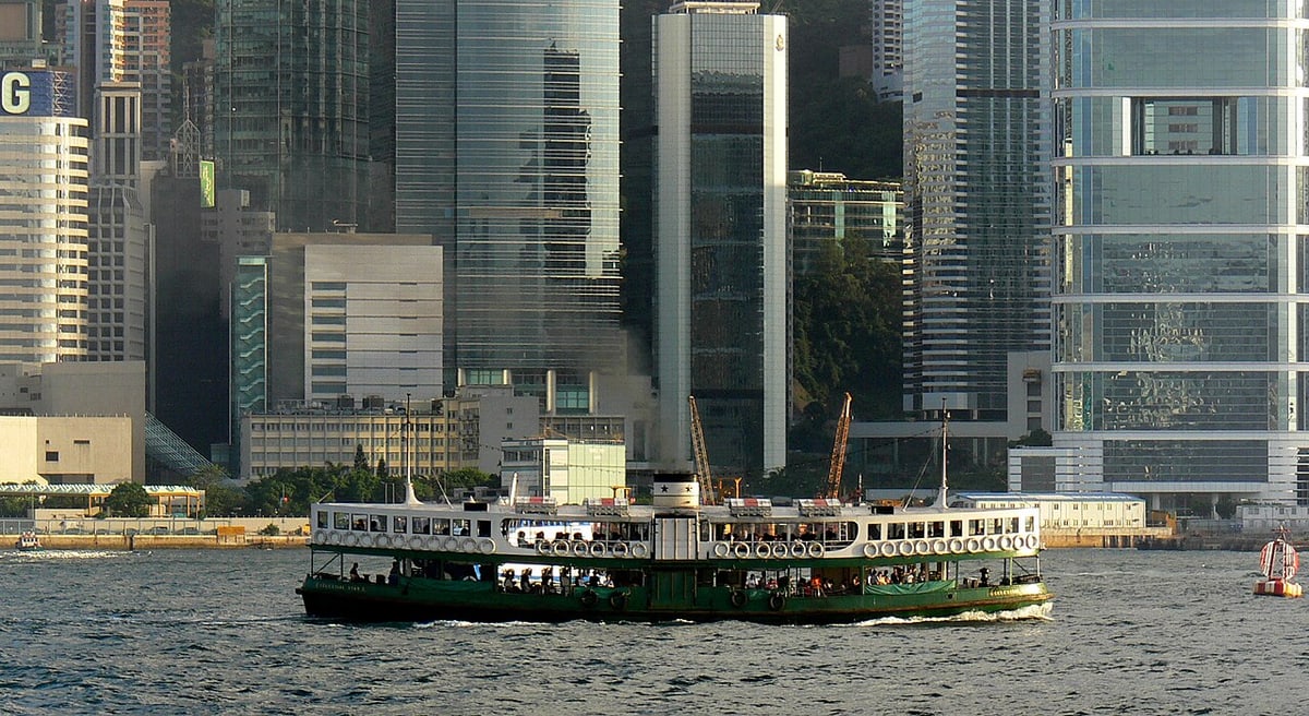 Star Ferry crossing Victoria Harbour with Hong Kong buildings behind it
