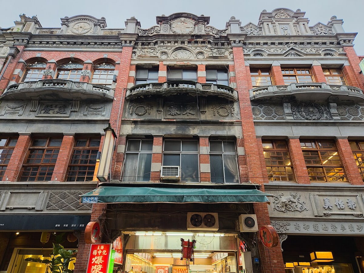 Historic red-brick shophouse façades on Dihua Street in Taipei
